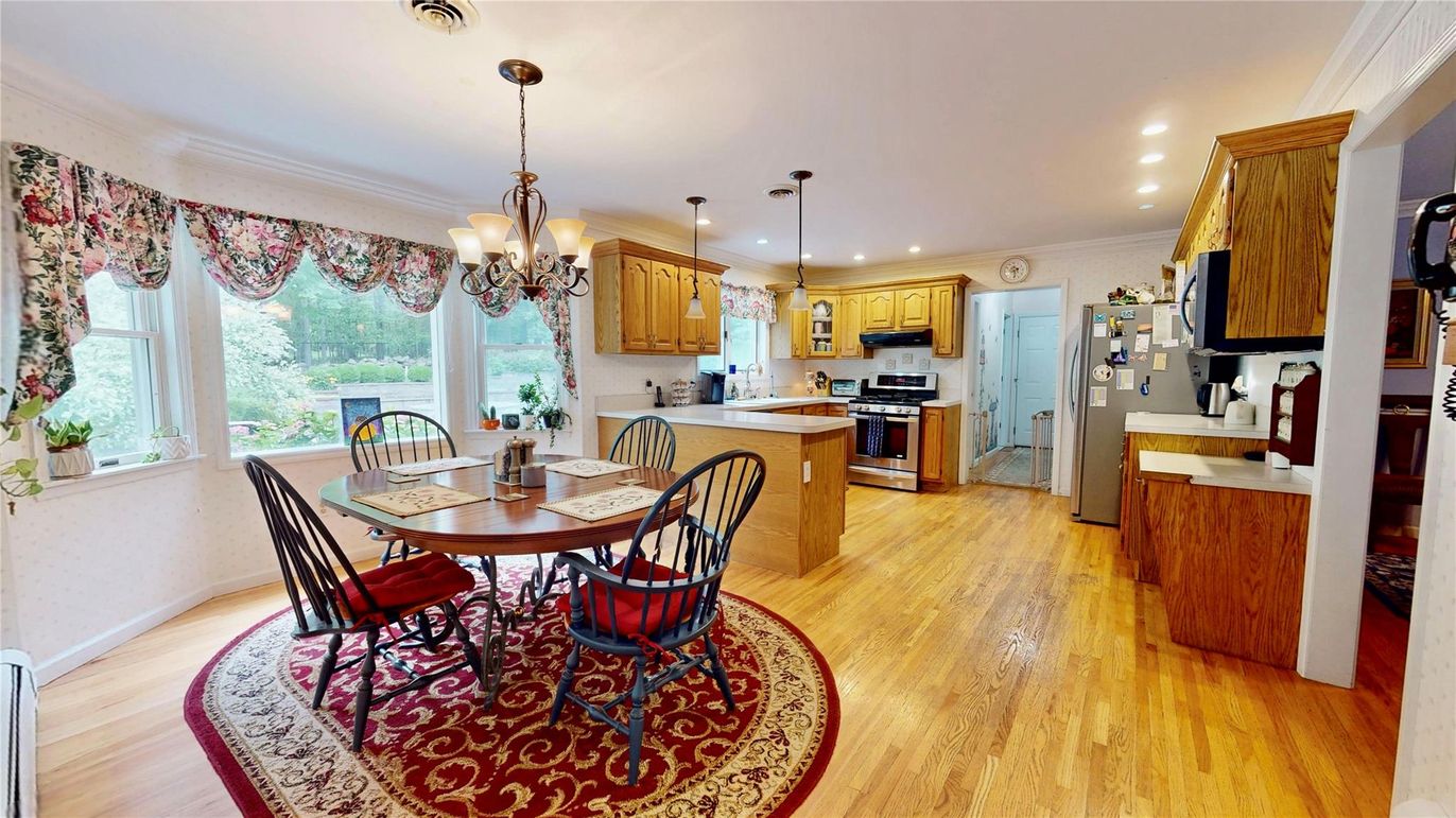 Chandelier, Dining room, Interior, Kitchen, Pendant Lights, Recessed Lighting, Stainless Steel Appliances, Wood Texture Flooring