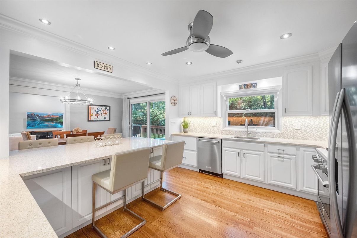 Dining room, Interior, Kitchen, Pendant Lights, Recessed Lighting, Stainless Steel Appliances, Wood Texture Flooring