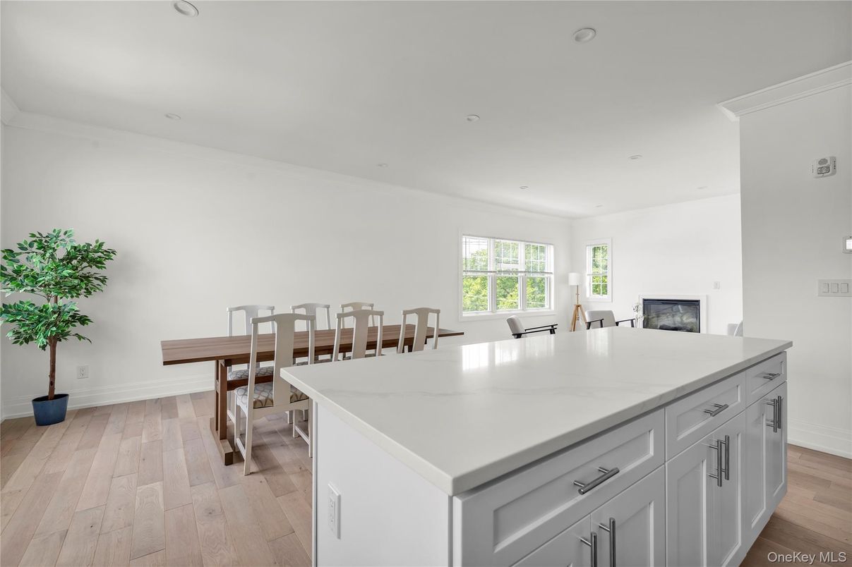 Dining room, Fireplace, Interior, Kitchen, Recessed Lighting, Wood Texture Flooring