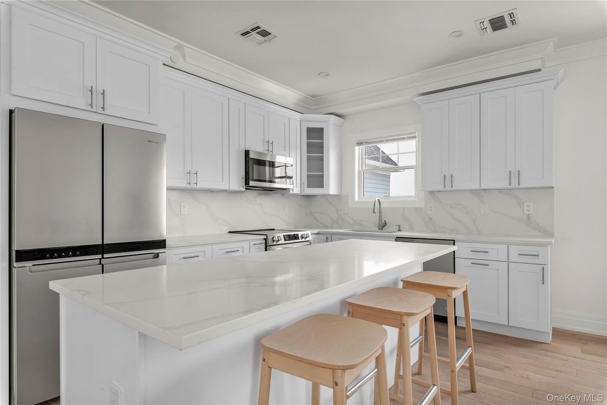 Interior, Kitchen, Marble Walls, Recessed Lighting, Stainless Steel Appliances, Wood Texture Flooring