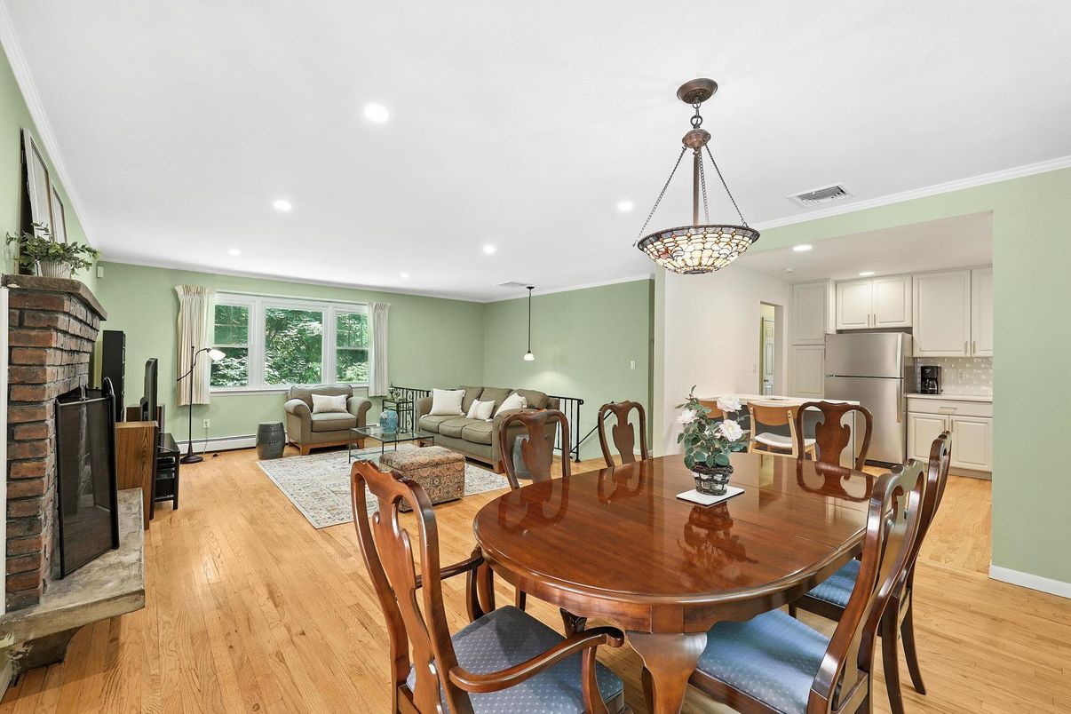 Dining room, Fireplace, Interior, Kitchen, Living room, Pendant Lights, Recessed Lighting, Stainless Steel Appliances, Wood Texture Flooring