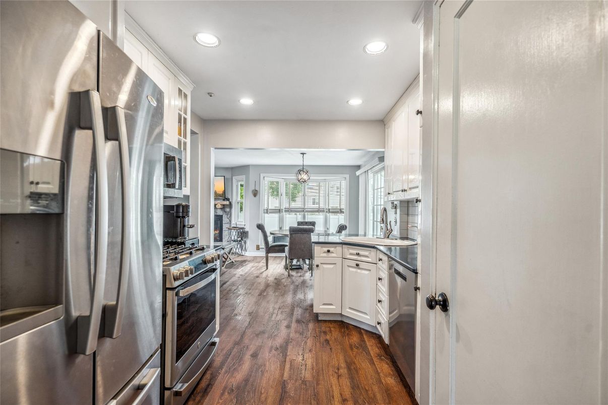 Dining room, Interior, Kitchen, Pendant Lights, Recessed Lighting, Stainless Steel Appliances, Wood Texture Flooring
