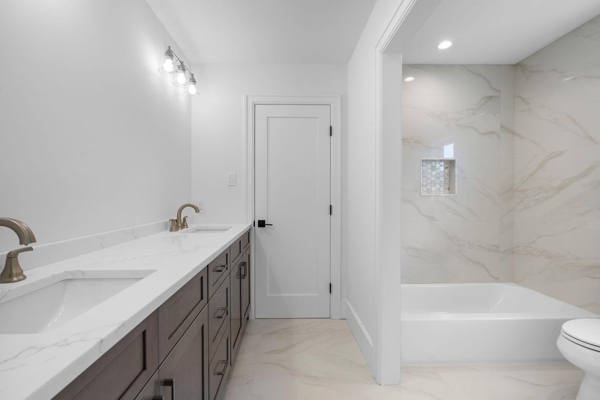 Bathroom, Dual Sink Vanities, Interior, Marble, Marble Walls, Recessed Lighting