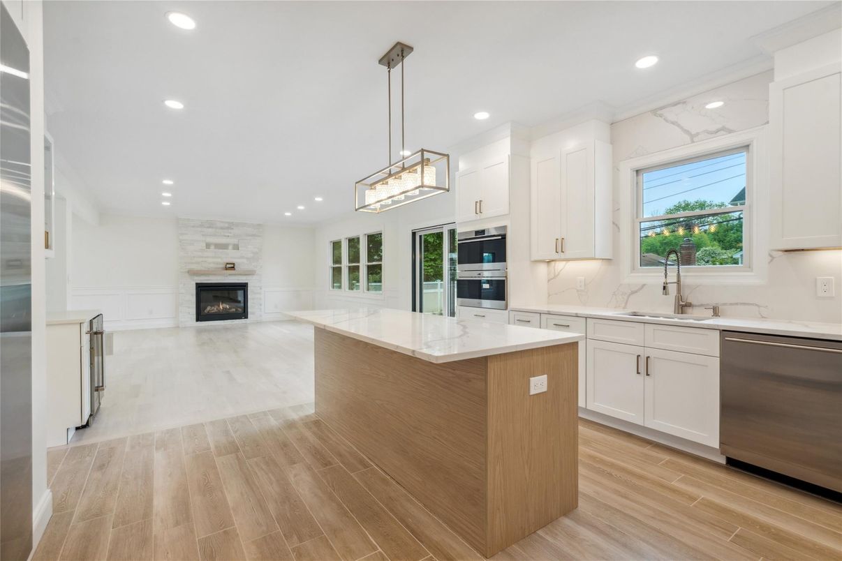 Fireplace, Interior, Kitchen, Pendant Lights, Recessed Lighting, Stainless Steel Appliances, Wood Texture Flooring