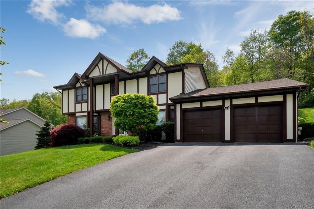Attached, Exterior, Facade, Tudor Revival