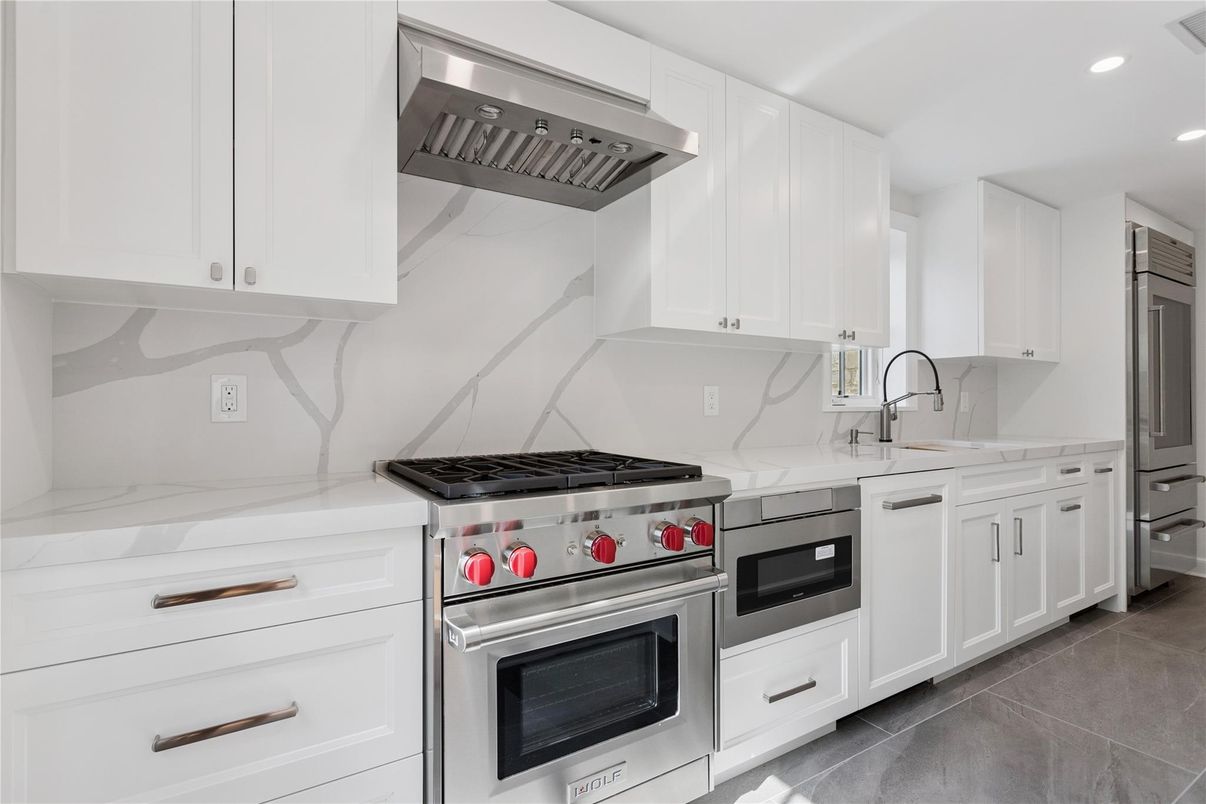 Interior, Kitchen, Marble Walls, Recessed Lighting, Stainless Steel Appliances