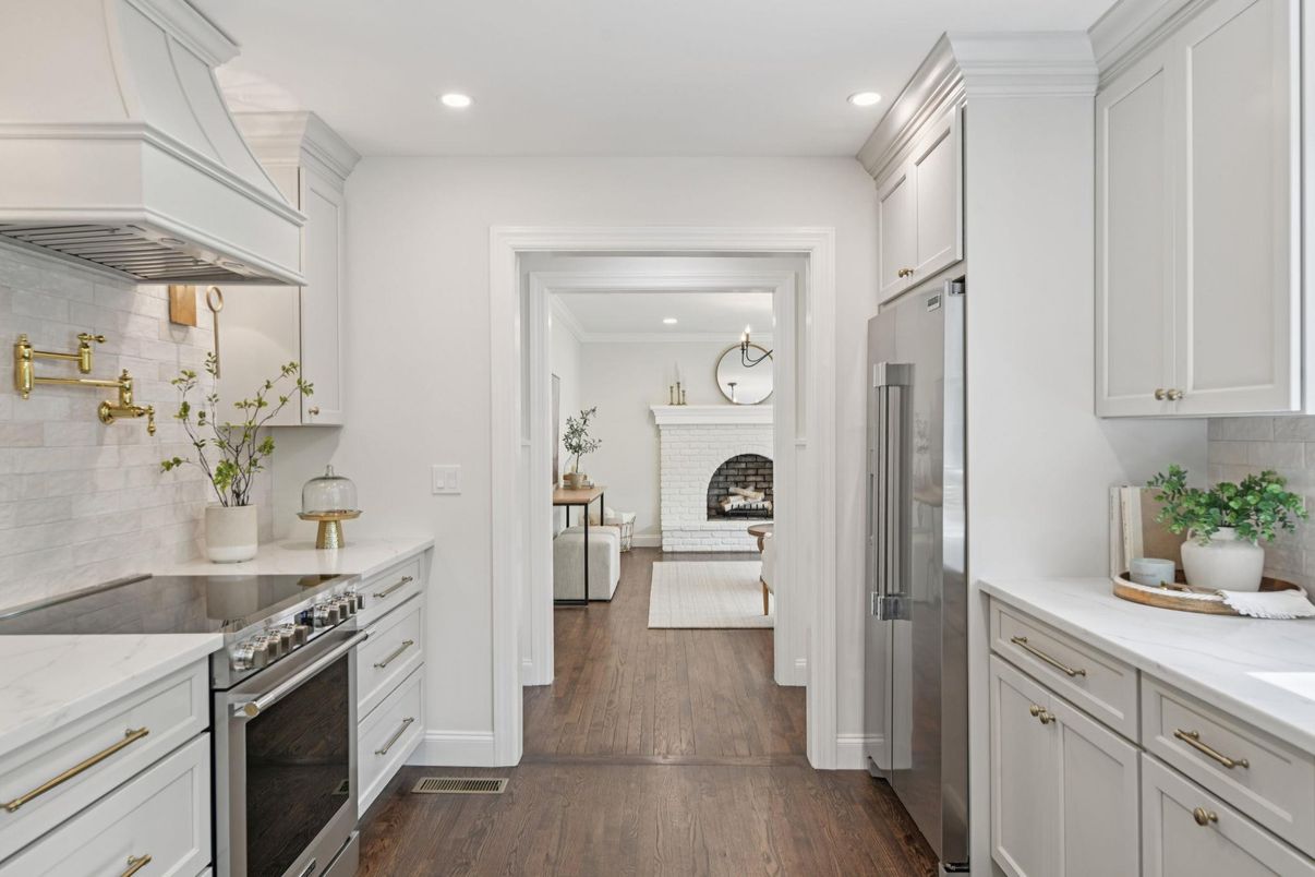 Fireplace, Interior, Kitchen, Recessed Lighting, Stainless Steel Appliances, Wood Texture Flooring