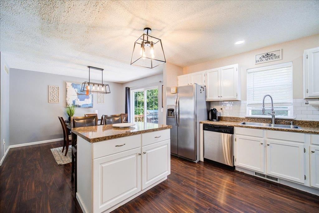 Dining room, Interior, Kitchen, Pendant Lights, Recessed Lighting, Stainless Steel Appliances, Wood Texture Flooring