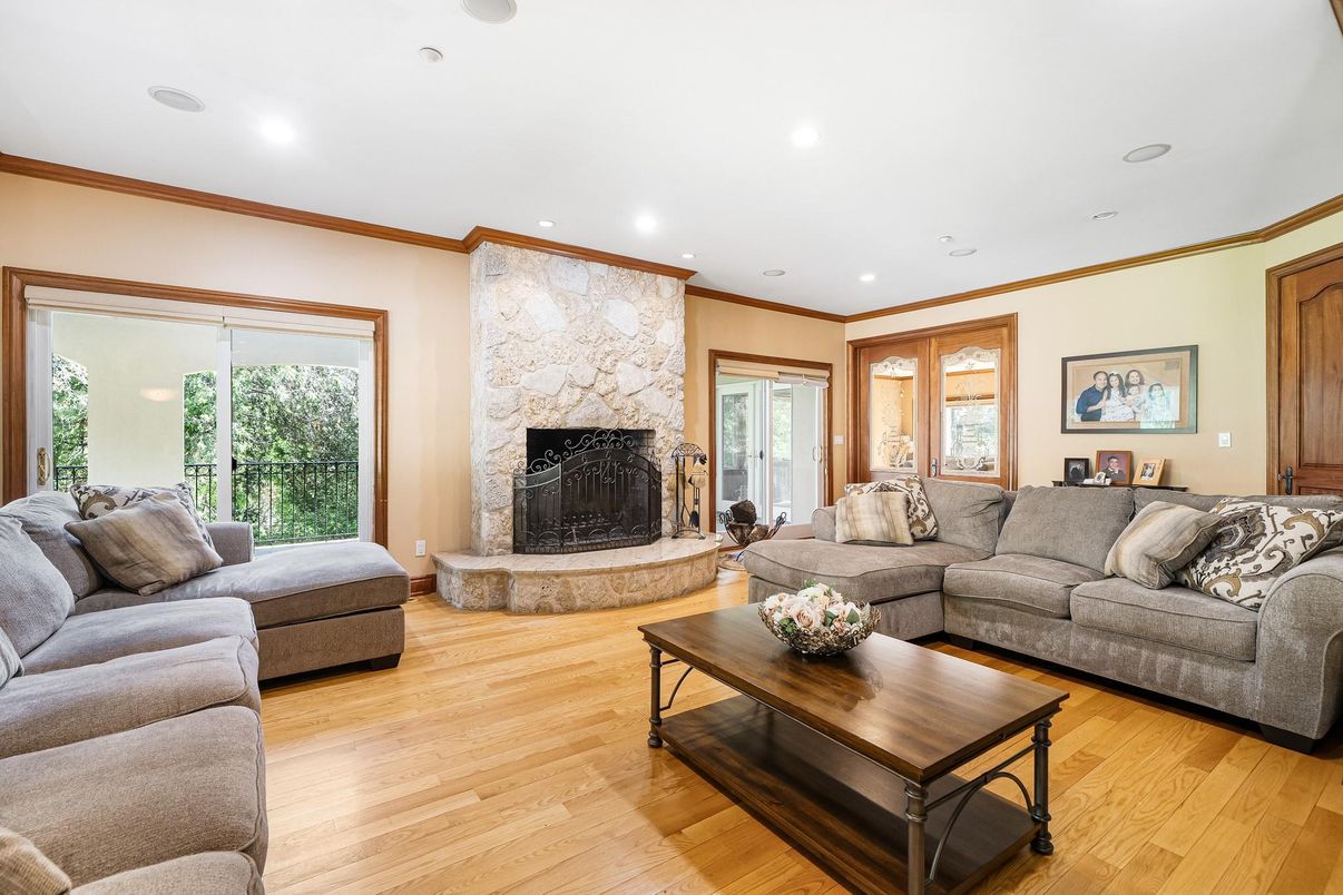 Fireplace, Interior, Living room, Recessed Lighting, Stone Walls, Wood Texture Flooring