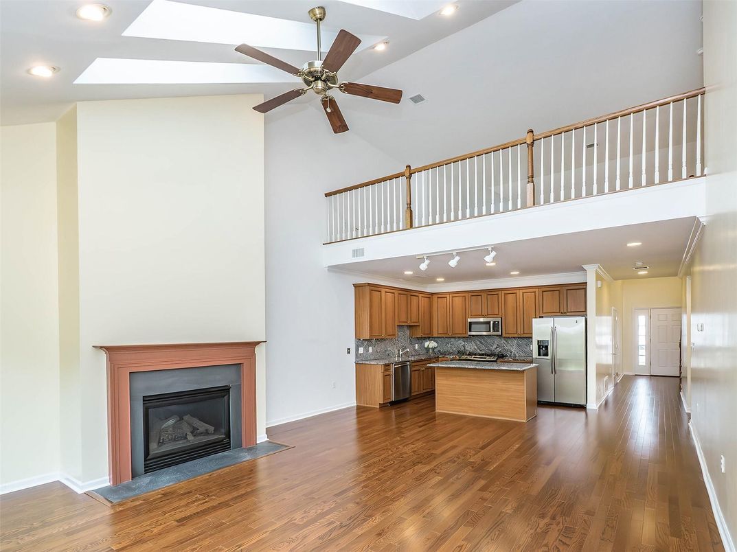 Fireplace, Interior, Kitchen, Recessed Lighting, Stainless Steel Appliances, Wood Texture Flooring