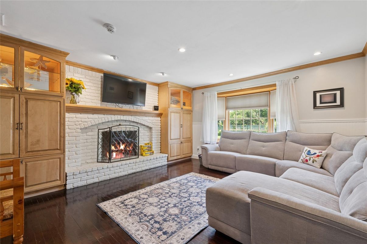 Fireplace, Interior, Living room, Recessed Lighting, Stone Walls, Wood Texture Flooring