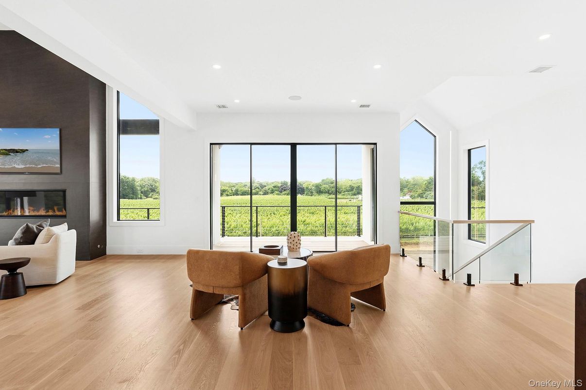 Dining room, Fireplace, Interior, Living room, Recessed Lighting, Wood Texture Flooring