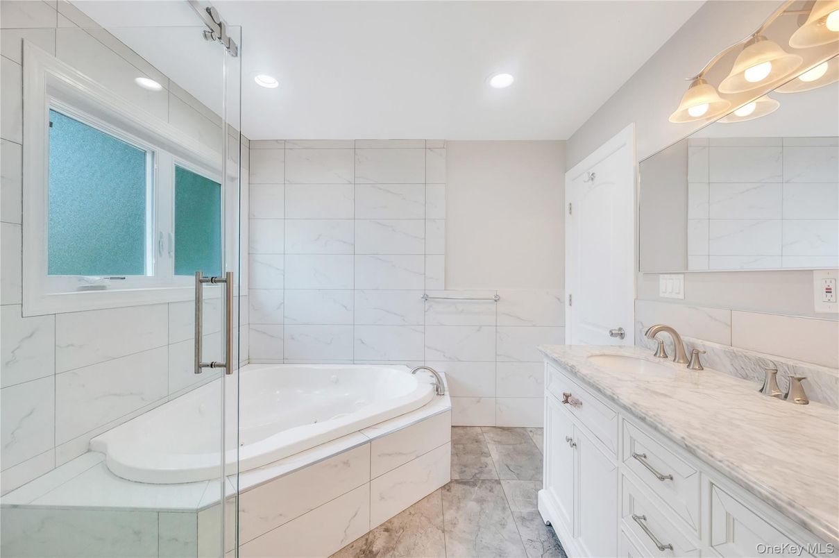 Bathroom, Dual Sink Vanities, Interior, Marble Walls, Recessed Lighting
