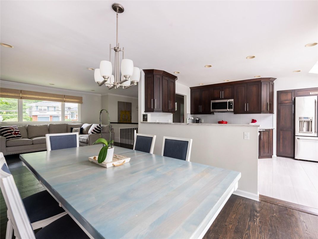 Chandelier, Dining room, Interior, Kitchen, Living room, Pendant Lights, Recessed Lighting, Stainless Steel Appliances, Wood Texture Flooring