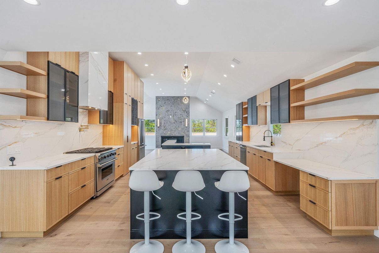 Interior, Kitchen, Marble Walls, Recessed Lighting, Stainless Steel Appliances, Wood Texture Flooring