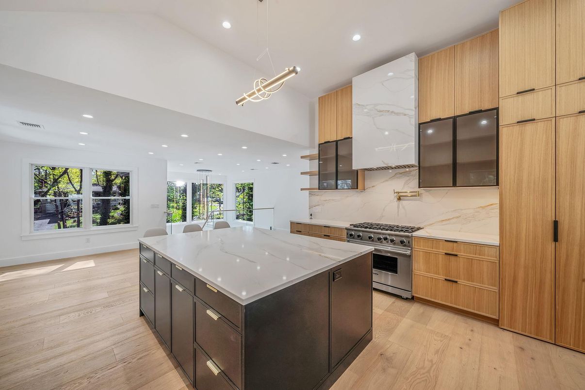 Interior, Kitchen, Marble Walls, Pendant Lights, Recessed Lighting, Stainless Steel Appliances, Wood Texture Flooring