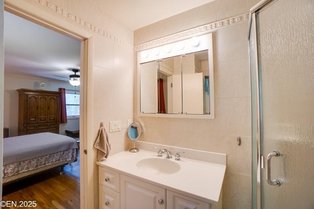 Bathroom, Bedroom, Dual Sink Vanities, Glass Shower, Interior, Wood Texture Flooring