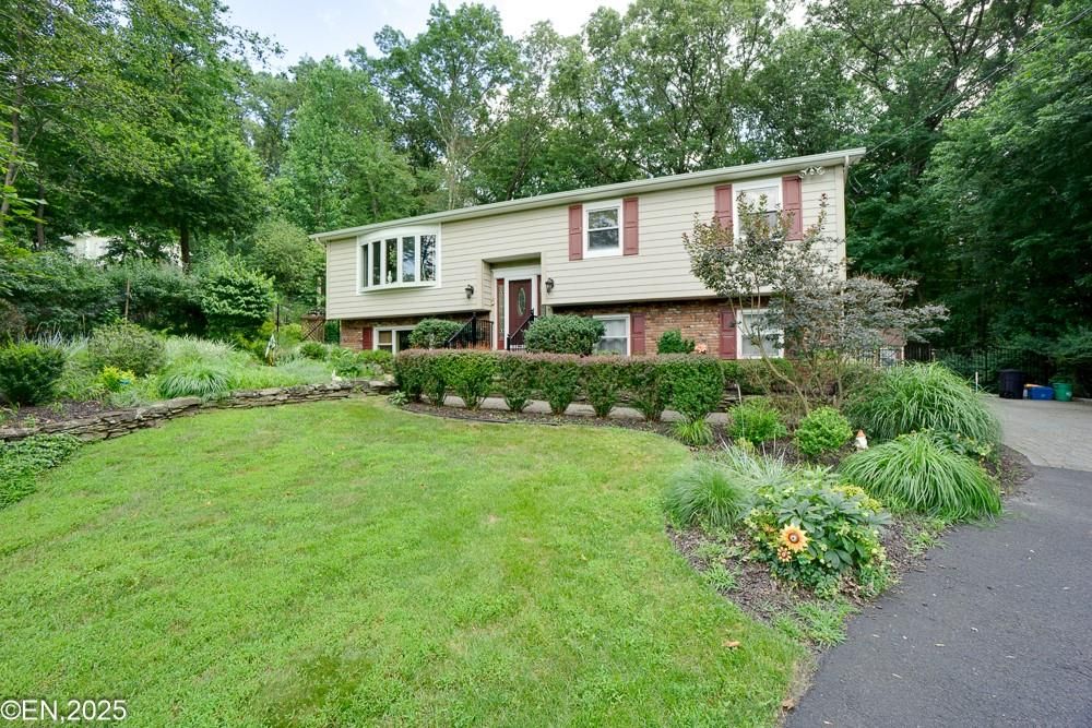 Backyard, Exterior, Facade, Brick Facade, Raised Ranch