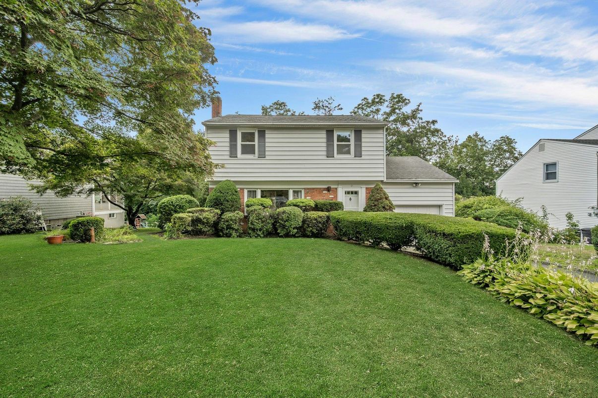 Attached, Backyard, Exterior, Facade, Brick Facade, Raised Ranch