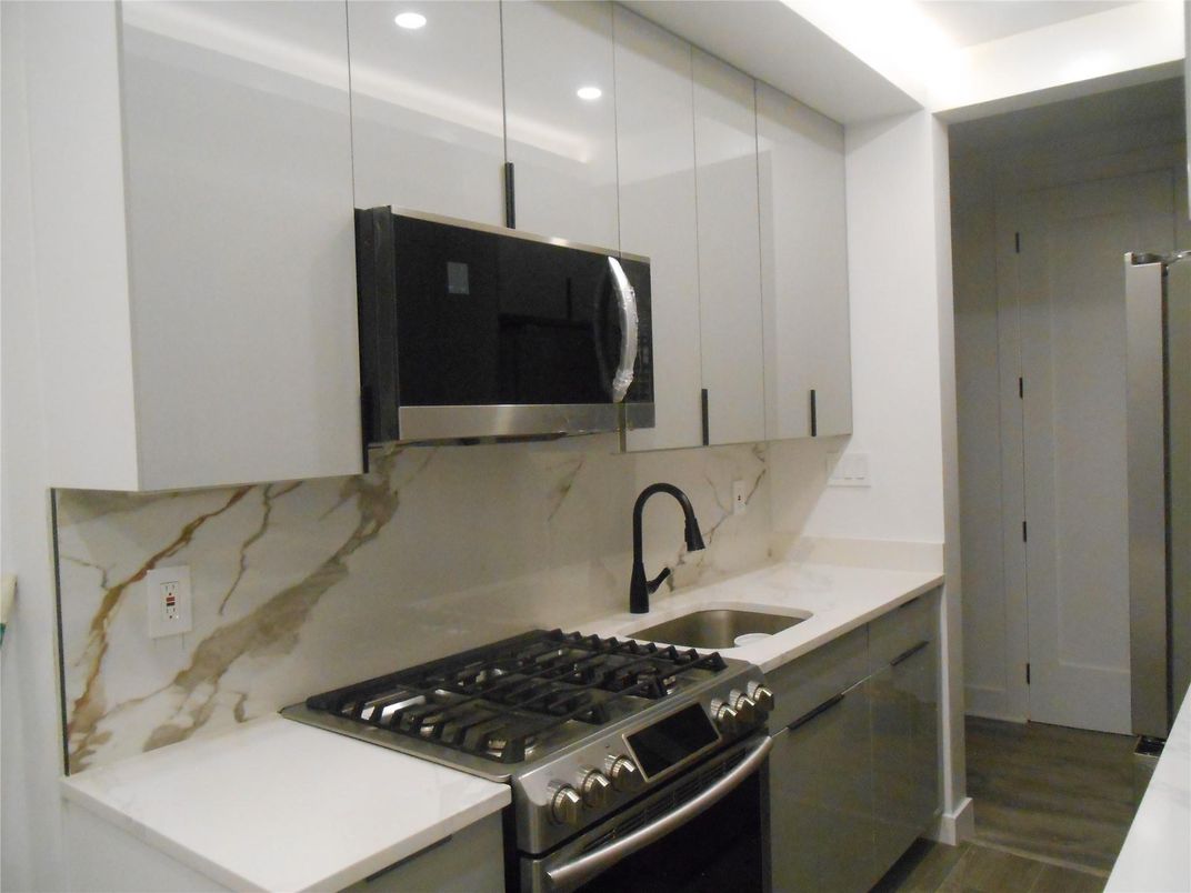 Interior, Kitchen, Marble Walls, Stainless Steel Appliances, Wood Texture Flooring