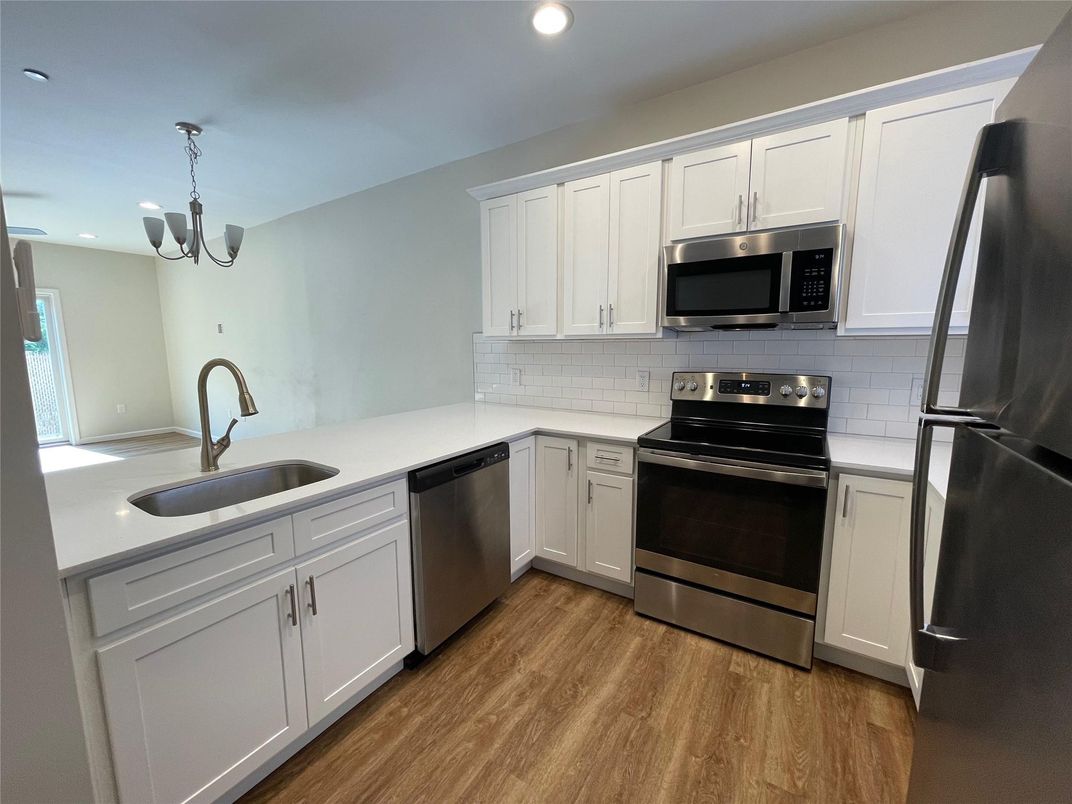 Chandelier, Interior, Kitchen, Recessed Lighting, Stainless Steel Appliances, Wood Texture Flooring