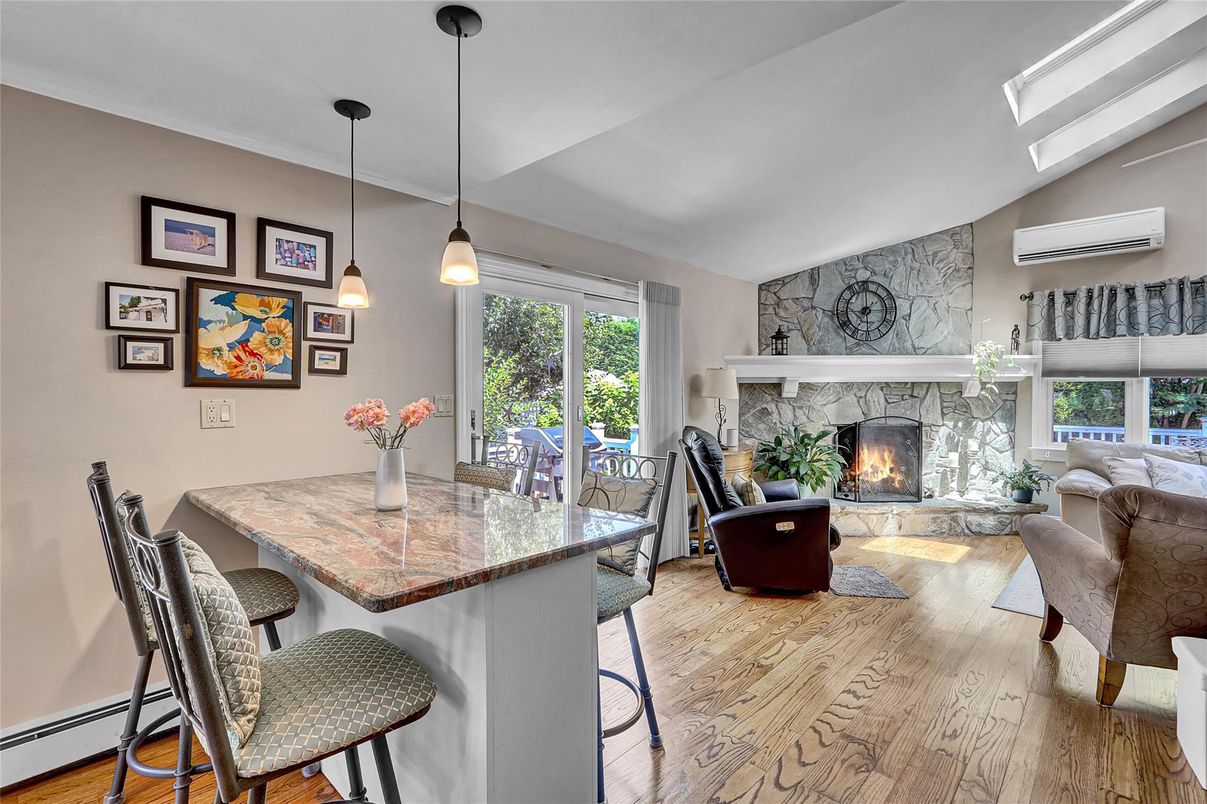 Dining room, Fireplace, Interior, Living room, Pendant Lights, Stone Walls, Wood Texture Flooring