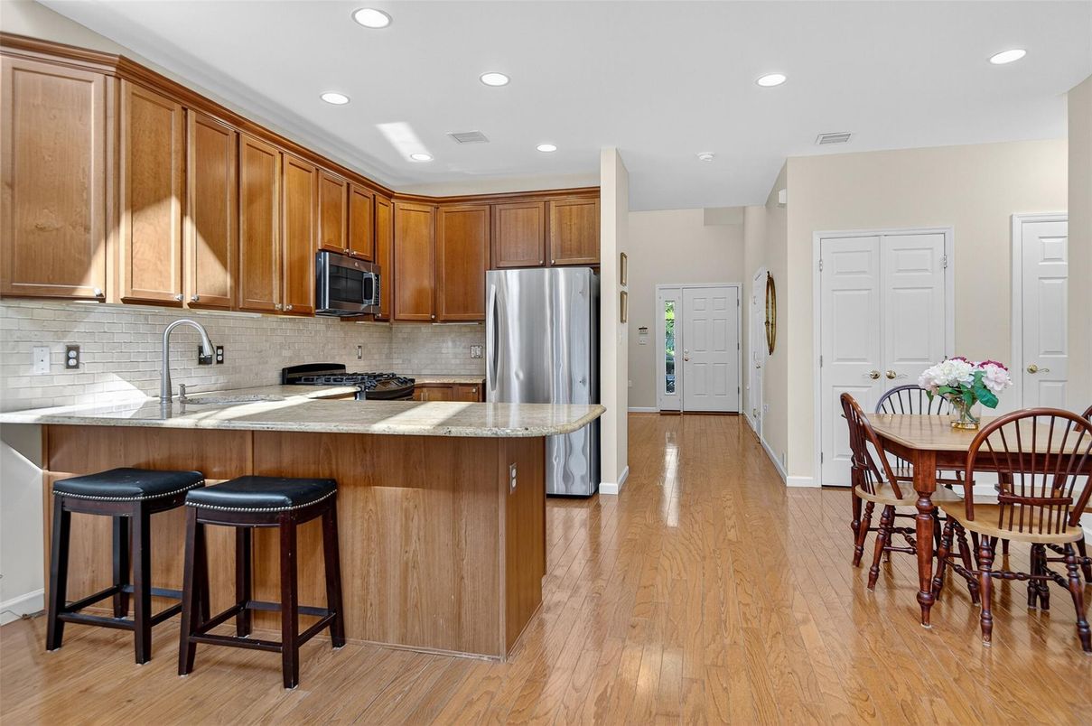 Dining room, Interior, Kitchen, Recessed Lighting, Stainless Steel Appliances, Wood Texture Flooring