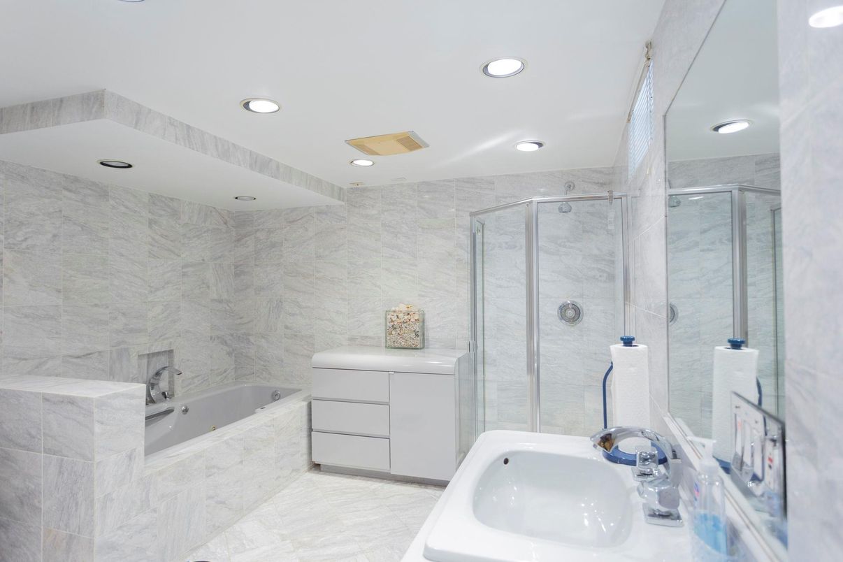 Bathroom, Dual Sink Vanities, Glass Shower, Interior, Marble, Marble Walls, Recessed Lighting