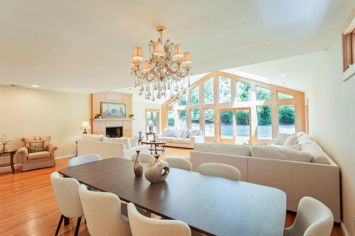 Chandelier, Dining room, Fireplace, Interior, Living room, Recessed Lighting, Water, Wood Texture Flooring