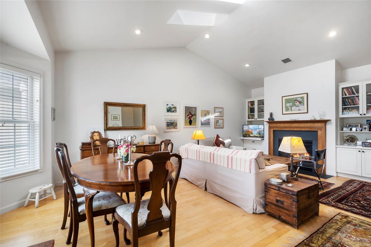 Dining room, Fireplace, Interior, Living room, Recessed Lighting, Wood Texture Flooring