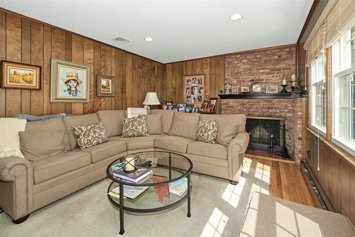 Fireplace, Interior, Living room, Recessed Lighting, Stone Walls, Wood Texture Flooring, Wooden Walls