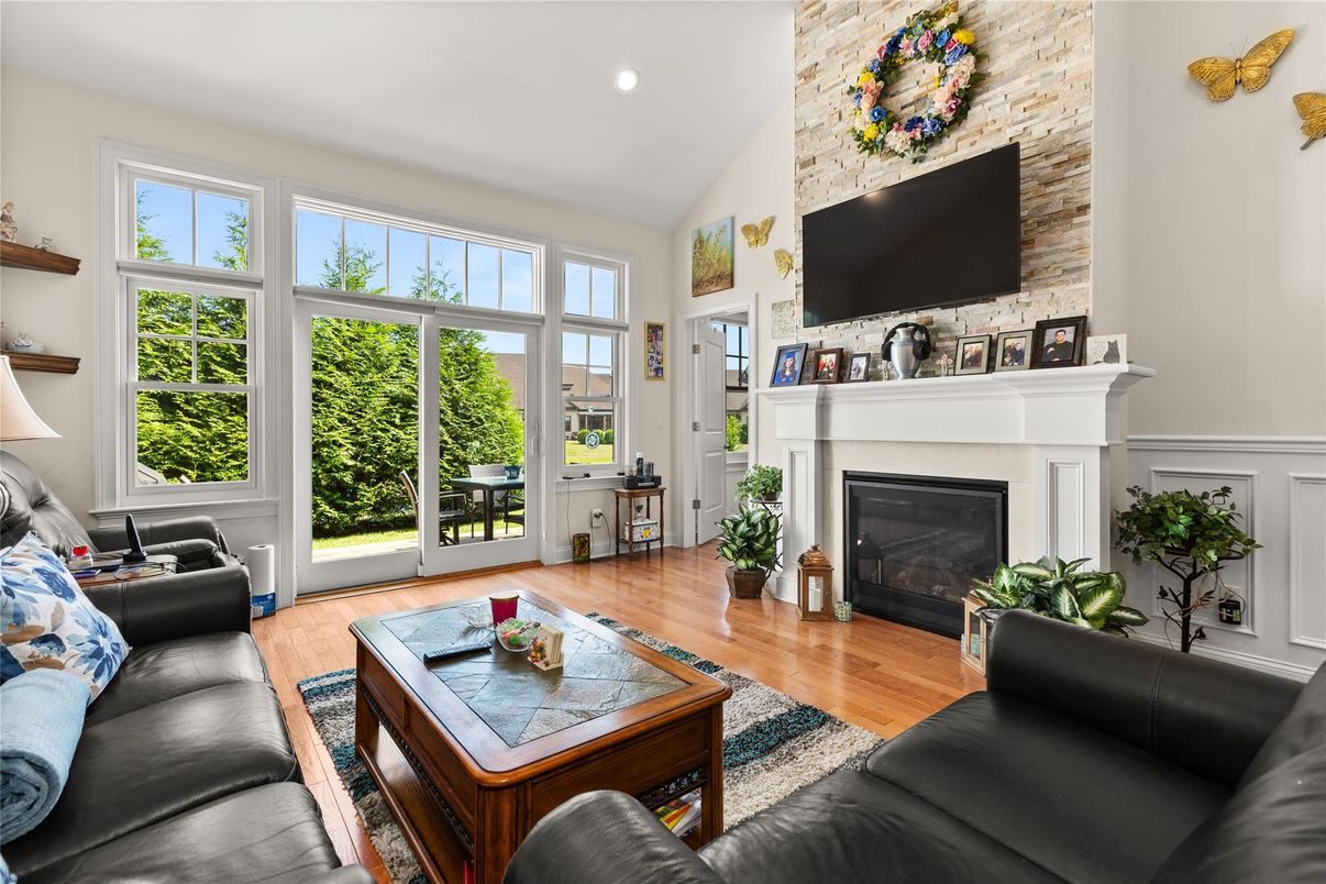Fireplace, Interior, Living room, Recessed Lighting, Stone Walls, Wood Texture Flooring