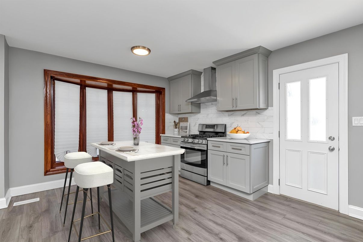 Interior, Kitchen, Marble Walls, Recessed Lighting, Stainless Steel Appliances, Wood Texture Flooring