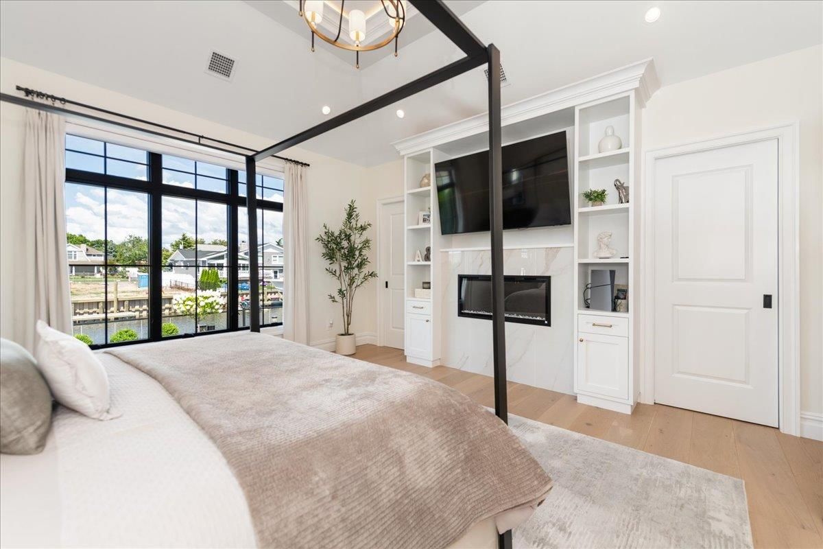 Bedroom, Fireplace, Interior, Recessed Lighting, Wood Texture Flooring