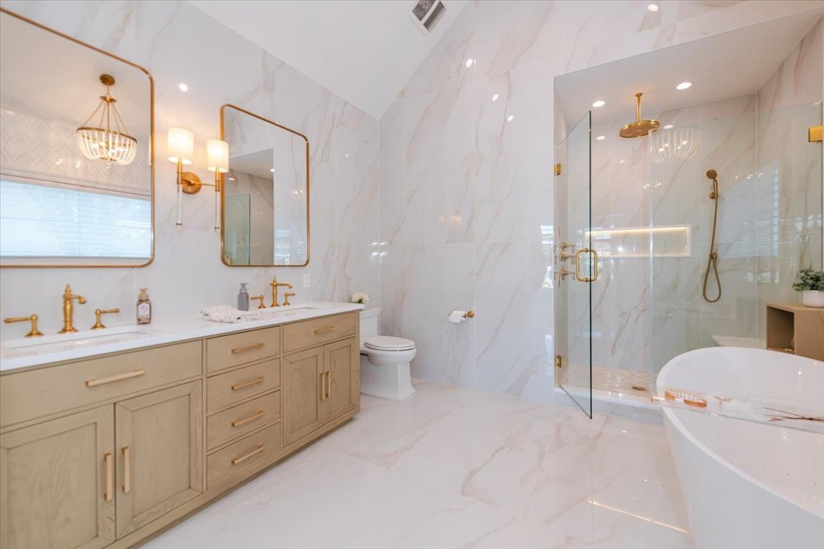 Bathroom, Dual Sink Vanities, Glass Shower, Interior, Marble, Marble Walls, Pendant Lights, Recessed Lighting