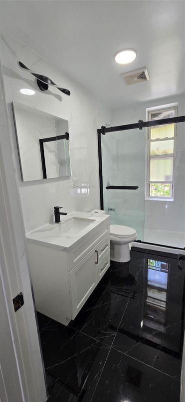 Bathroom, Dual Sink Vanities, Glass Shower, Interior, Marble, Recessed Lighting
