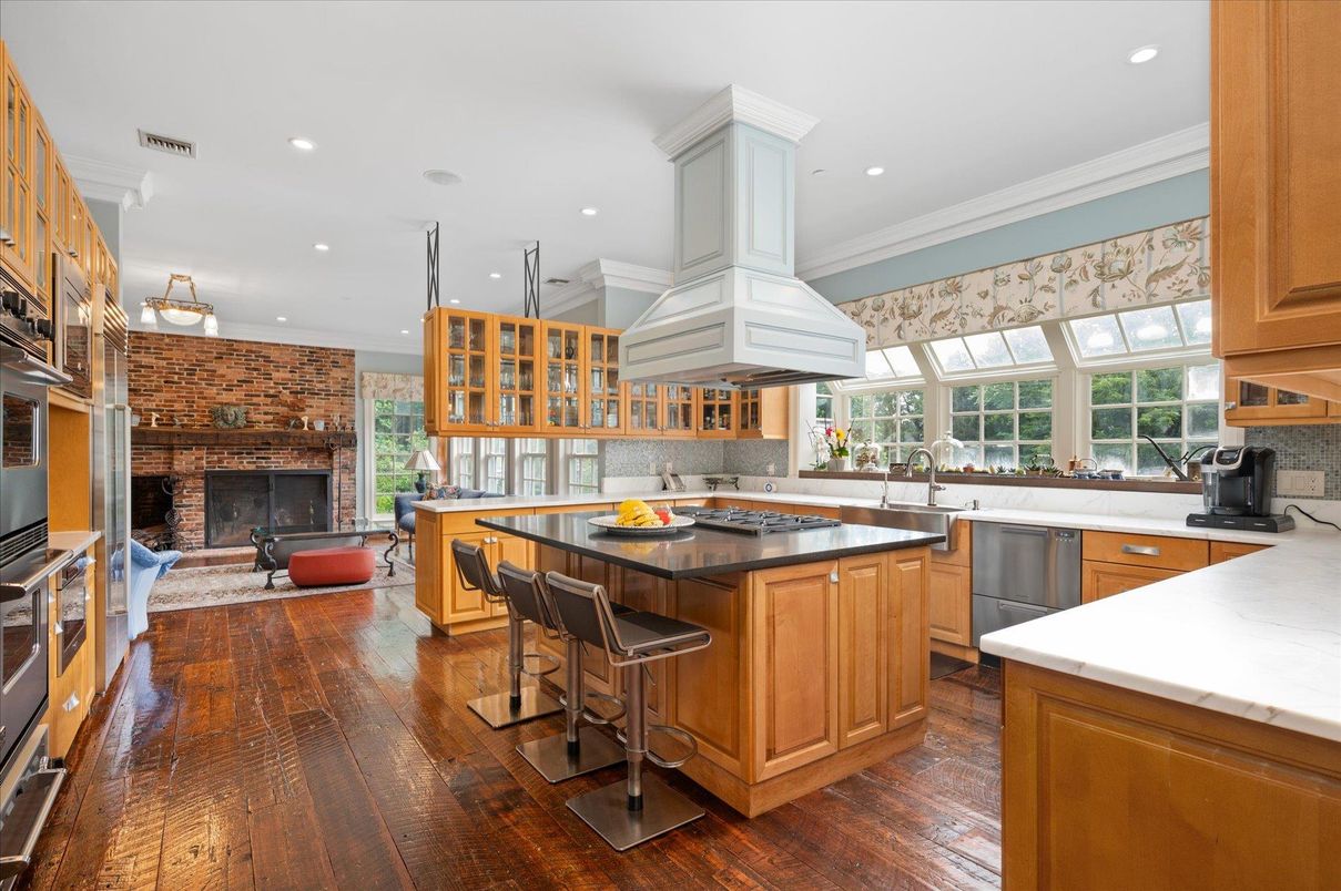 Fireplace, Interior, Kitchen, Pendant Lights, Recessed Lighting, Stainless Steel Appliances, Stone Walls, Wood Texture Flooring