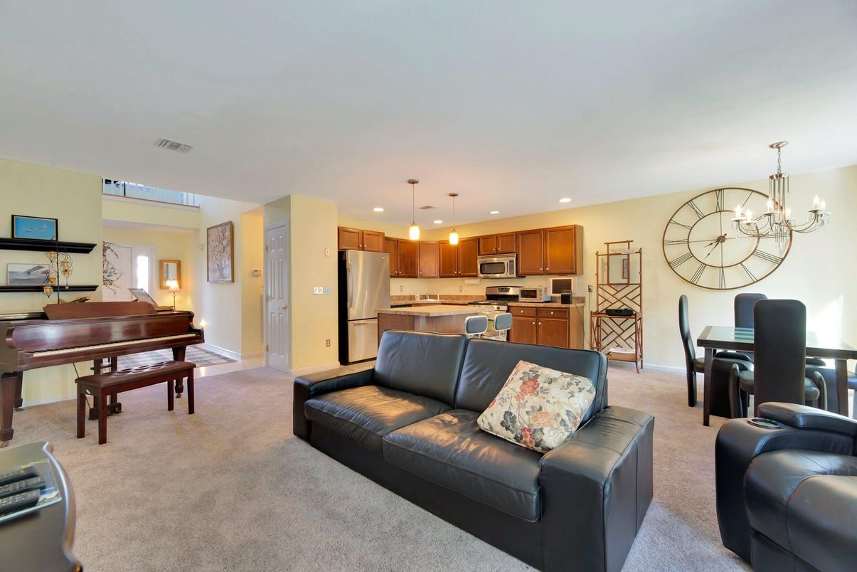 Chandelier, Dining room, Interior, Kitchen, Living room, Pendant Lights, Piano, Recessed Lighting, Stainless Steel Appliances