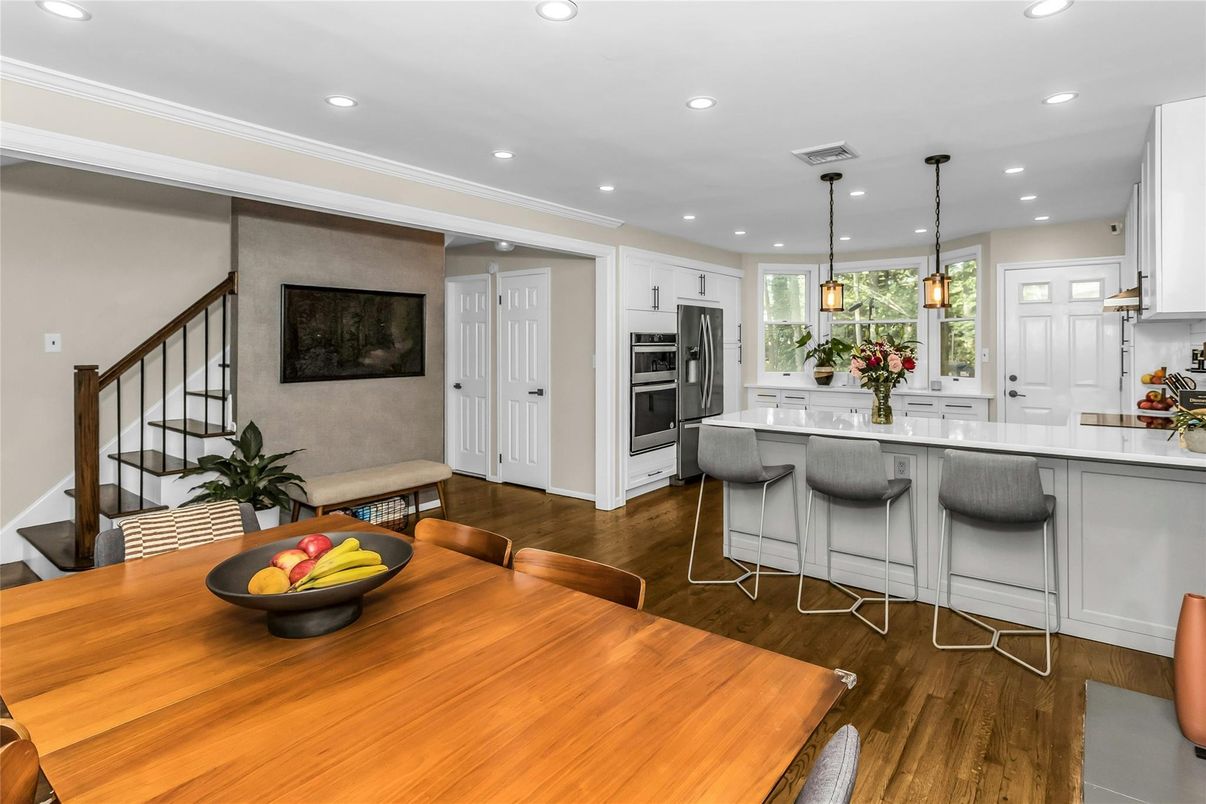 Dining room, Interior, Kitchen, Pendant Lights, Recessed Lighting, Stainless Steel Appliances, Wood Texture Flooring