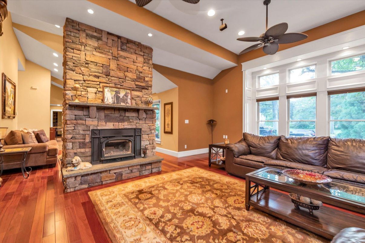 Fireplace, Interior, Living room, Recessed Lighting, Stone Walls, Wood Texture Flooring