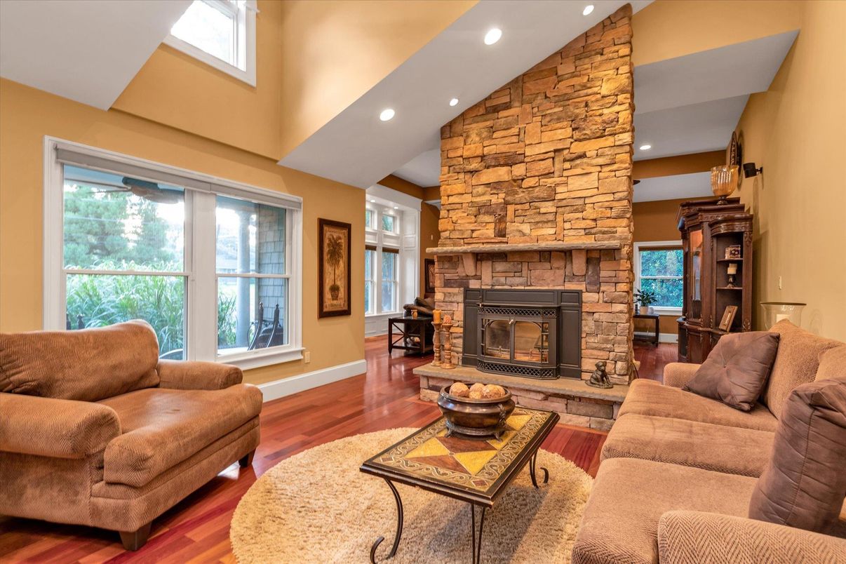 Fireplace, Interior, Living room, Recessed Lighting, Stone Walls, Wood Texture Flooring