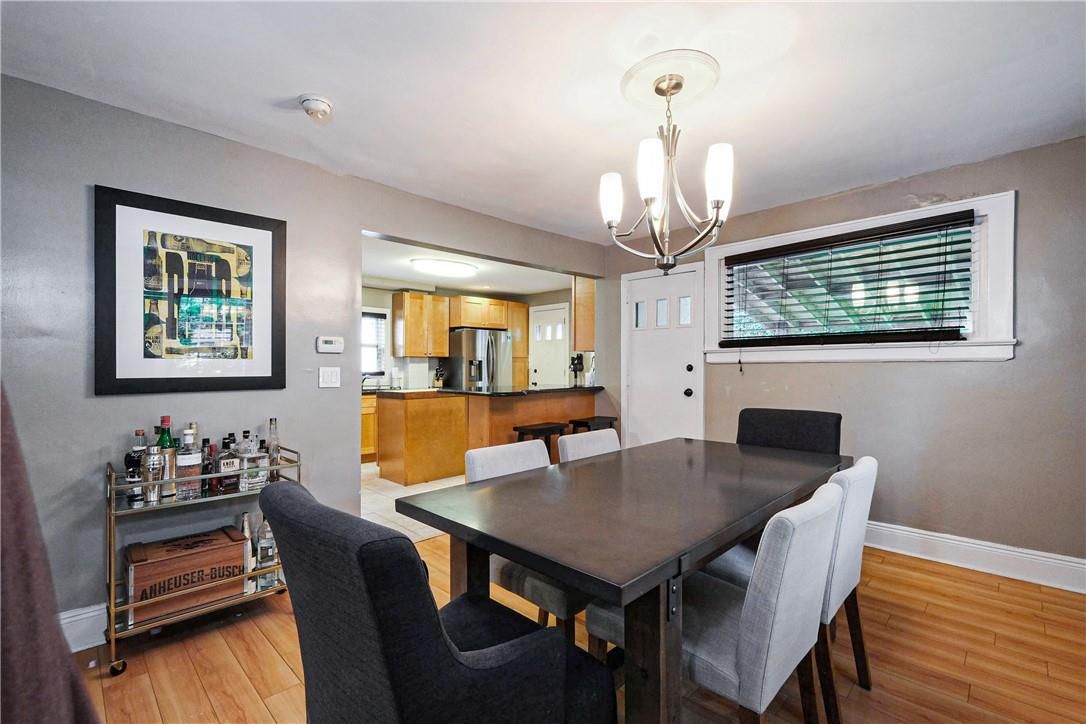 Chandelier, Dining room, Interior, Kitchen, Stainless Steel Appliances, Wood Texture Flooring