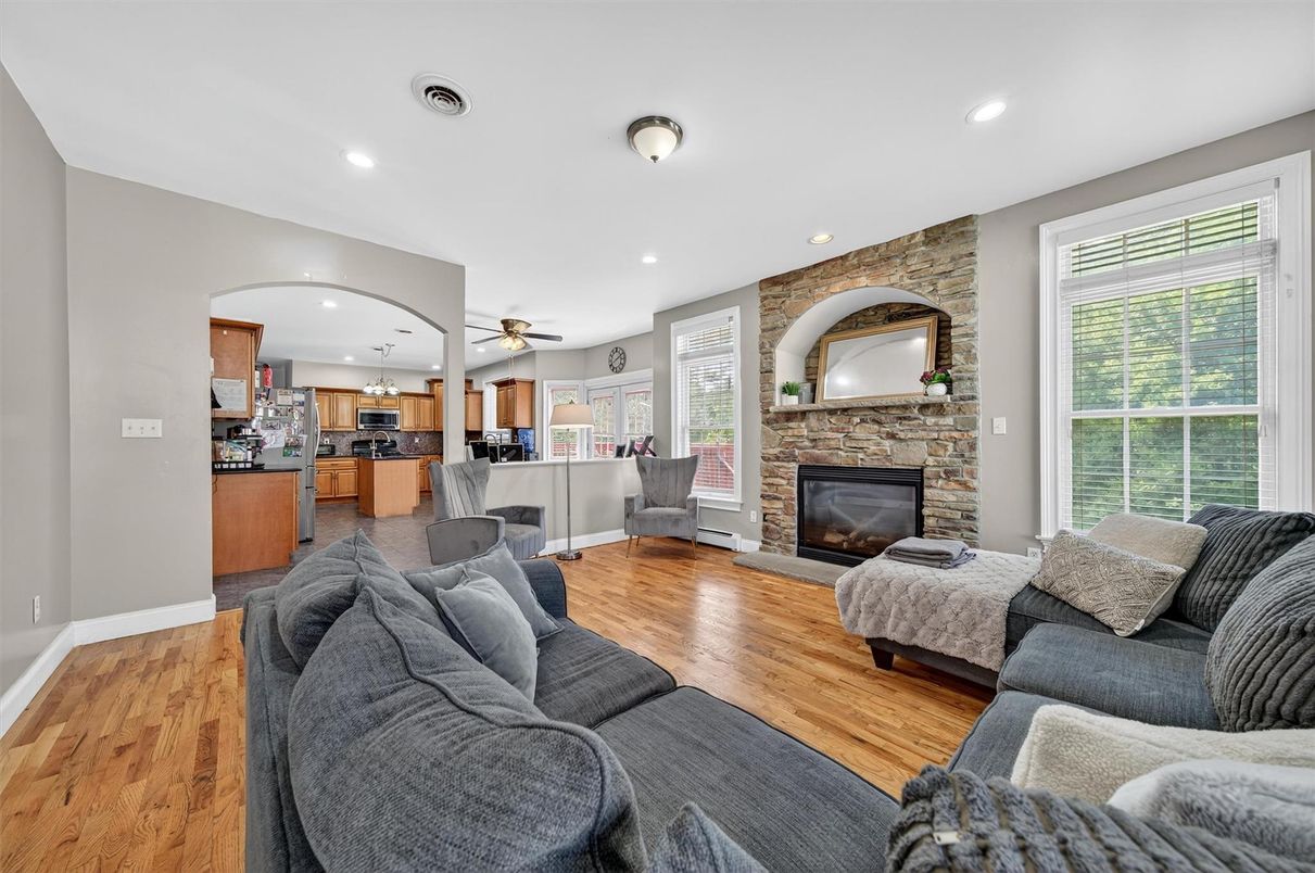 Fireplace, Interior, Kitchen, Living room, Recessed Lighting, Stone Walls, Wood Texture Flooring