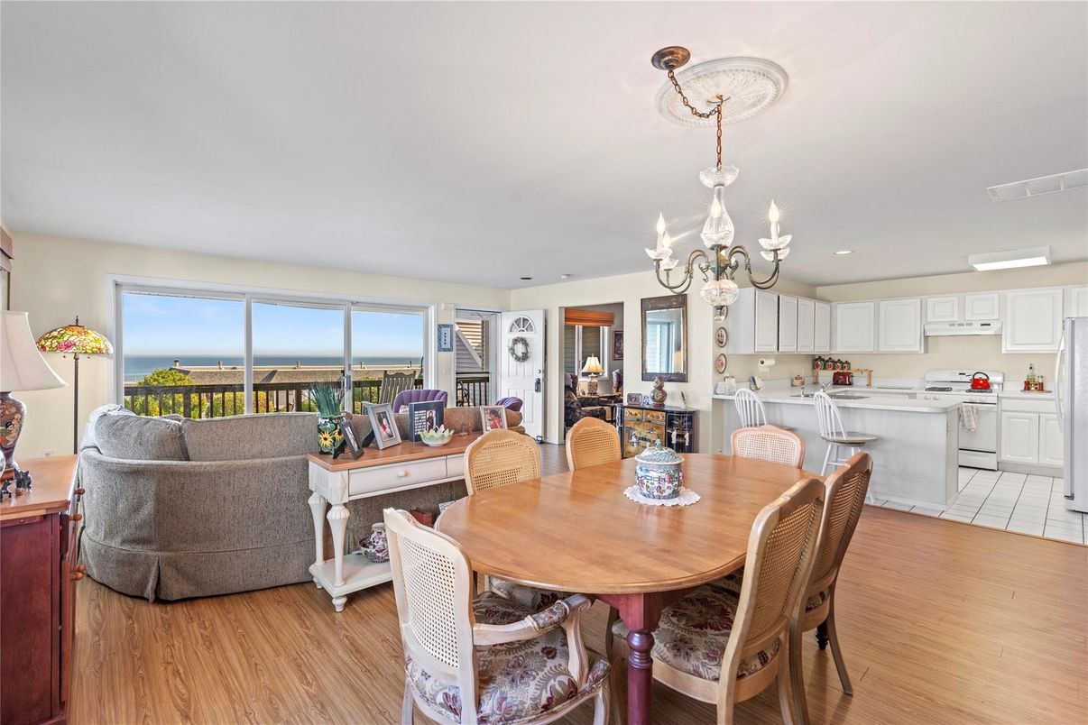 Chandelier, Dining room, Interior, Kitchen, Living room, Recessed Lighting, Water, Wood Texture Flooring
