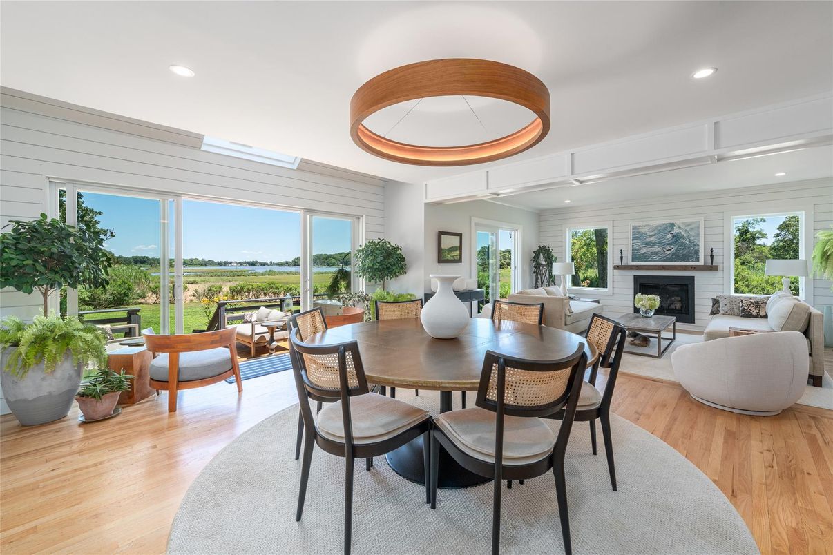 Dining room, Fireplace, Interior, Living room, Pendant Lights, Recessed Lighting, Wood Texture Flooring