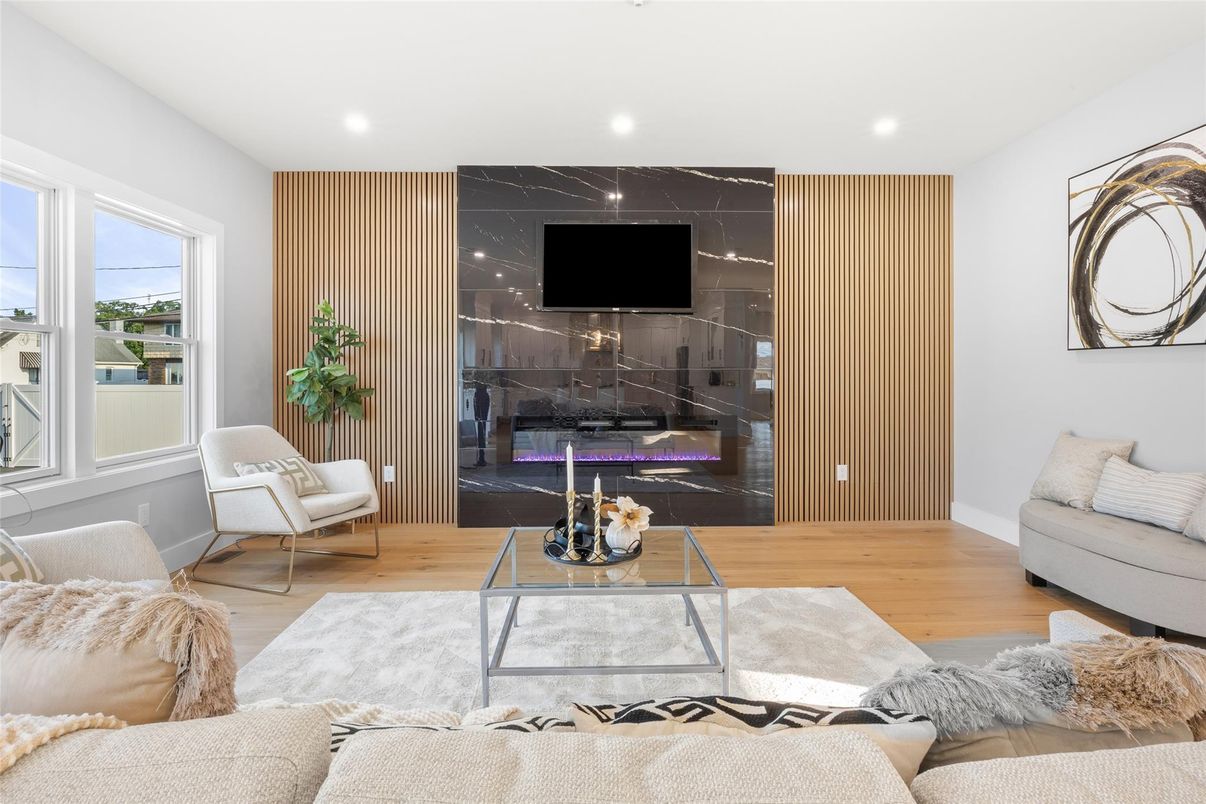 Fireplace, Interior, Living room, Marble Walls, Recessed Lighting, Wood Texture Flooring