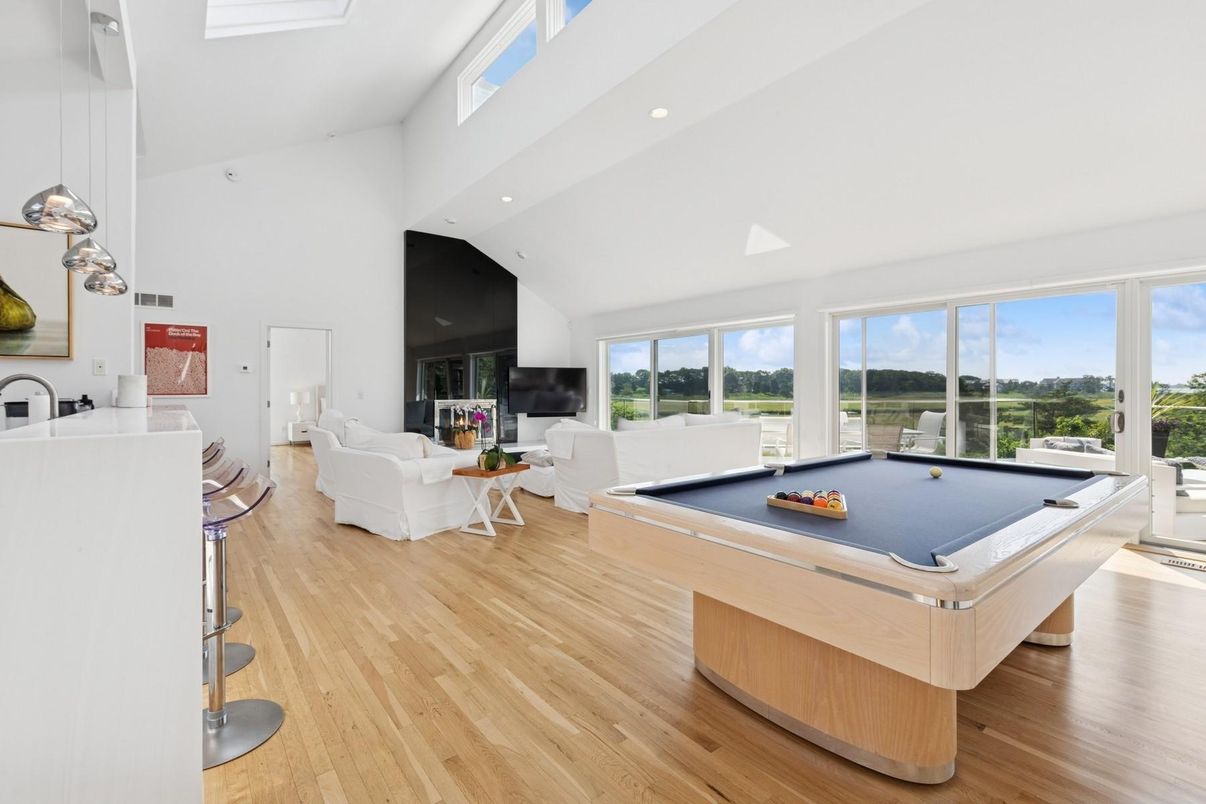 Billiard Table, Fireplace, Game Room, Interior, Living room, Pendant Lights, Recessed Lighting, Wood Texture Flooring