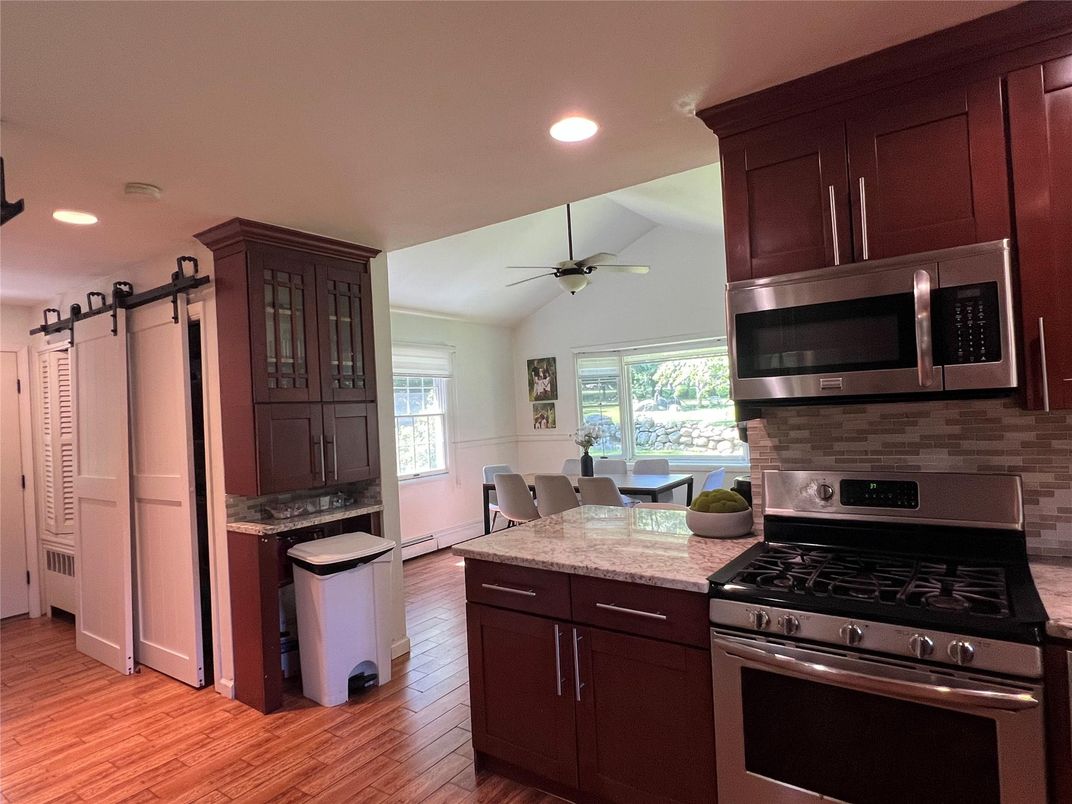 Dining room, Interior, Kitchen, Recessed Lighting, Stainless Steel Appliances, Wood Texture Flooring