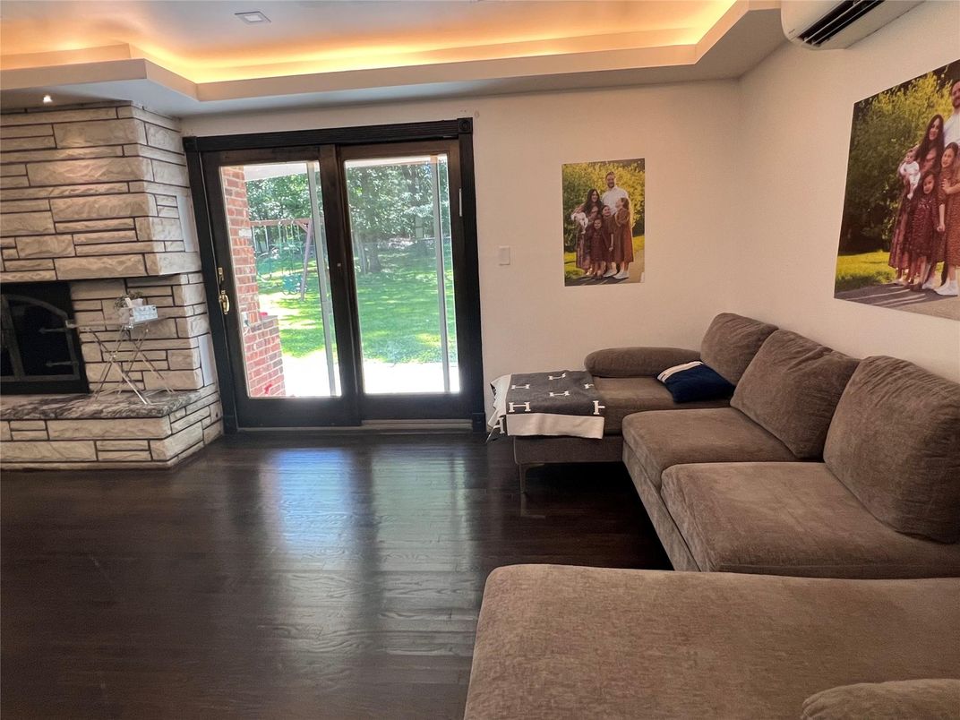 Fireplace, Interior, Living room, Recessed Lighting, Stone Walls, Wood Texture Flooring