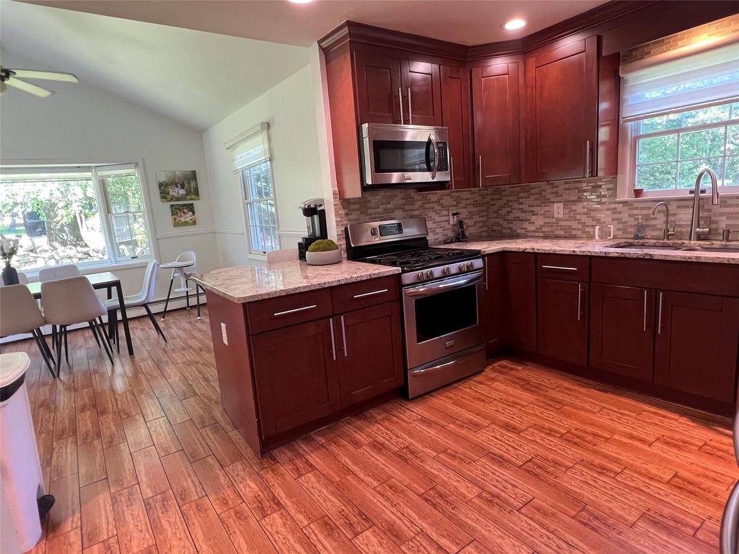 Dining room, Interior, Kitchen, Recessed Lighting, Stainless Steel Appliances, Wood Texture Flooring